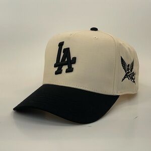 LA Snapback Hat – Cream & Black with Masked Cherub Embroidery